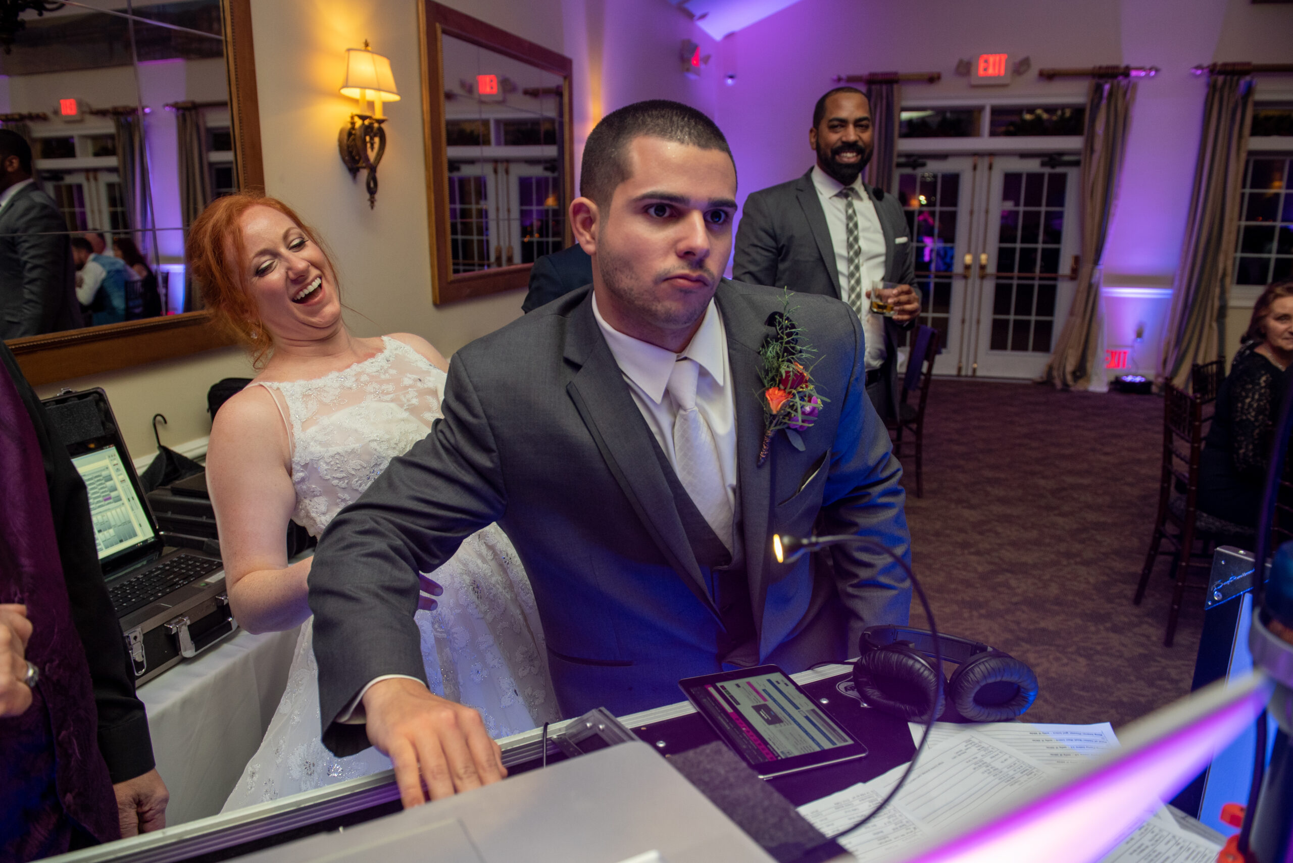 CT wedding DJ groom behind DJ booth bride laughing Riverhouse at Goodwin Park Hartford CT