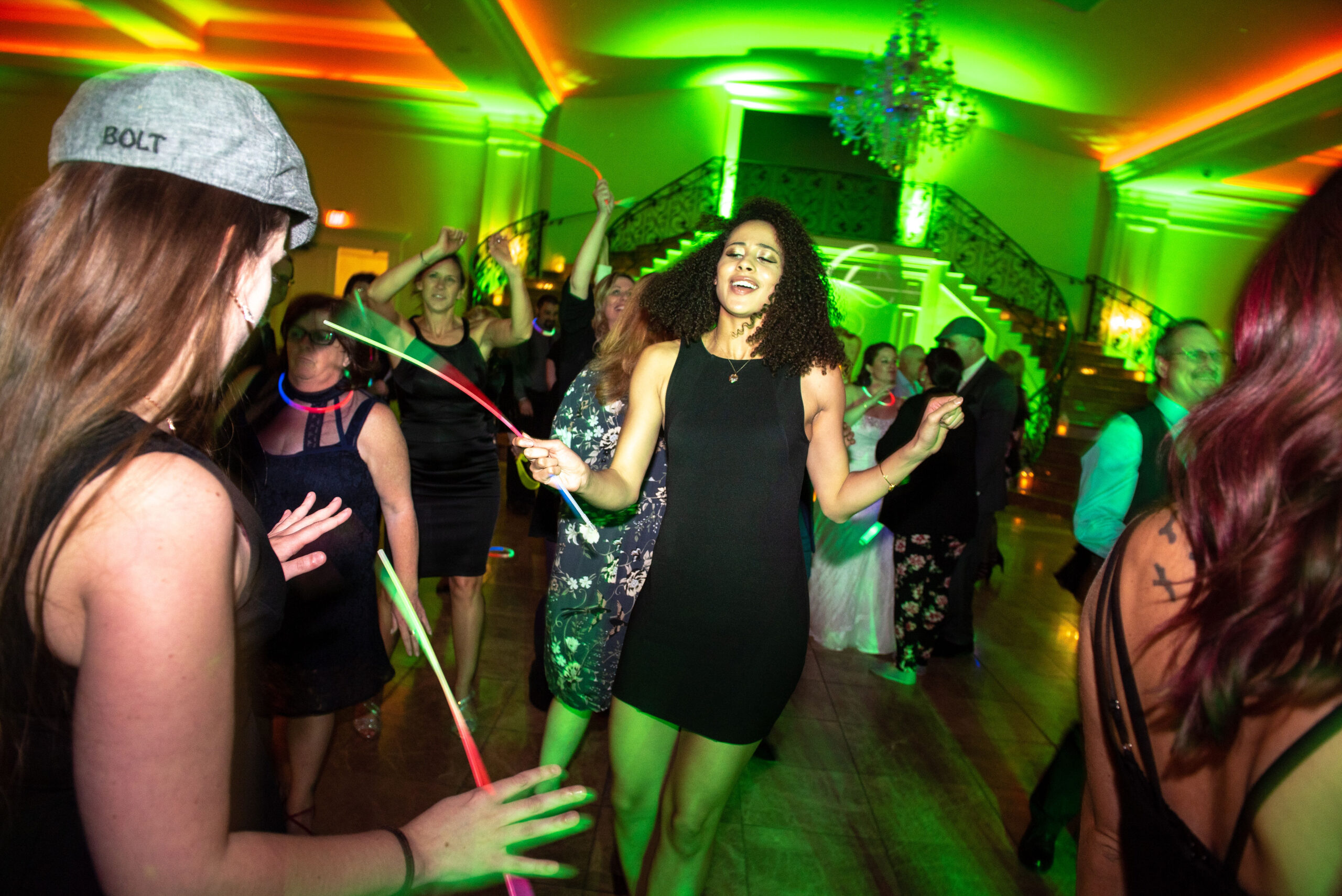 CT wedding lighting green uplighting guests dancing and neon ropes at Aria
