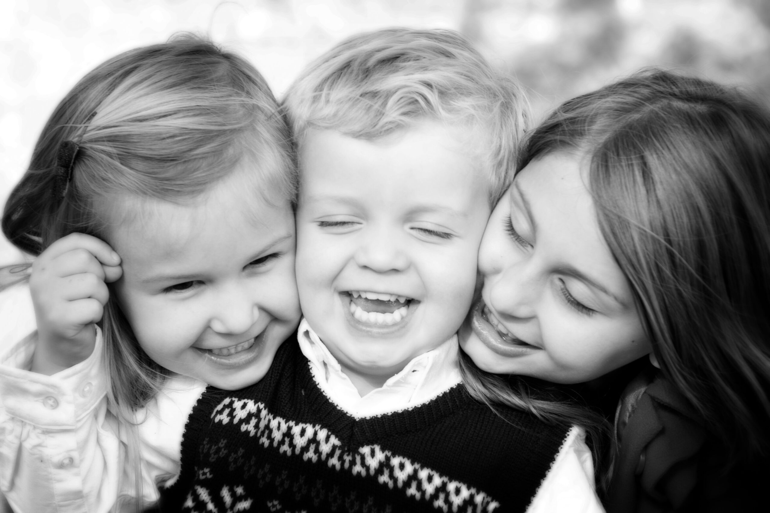 CT family photography three siblings laughing black and white portrait