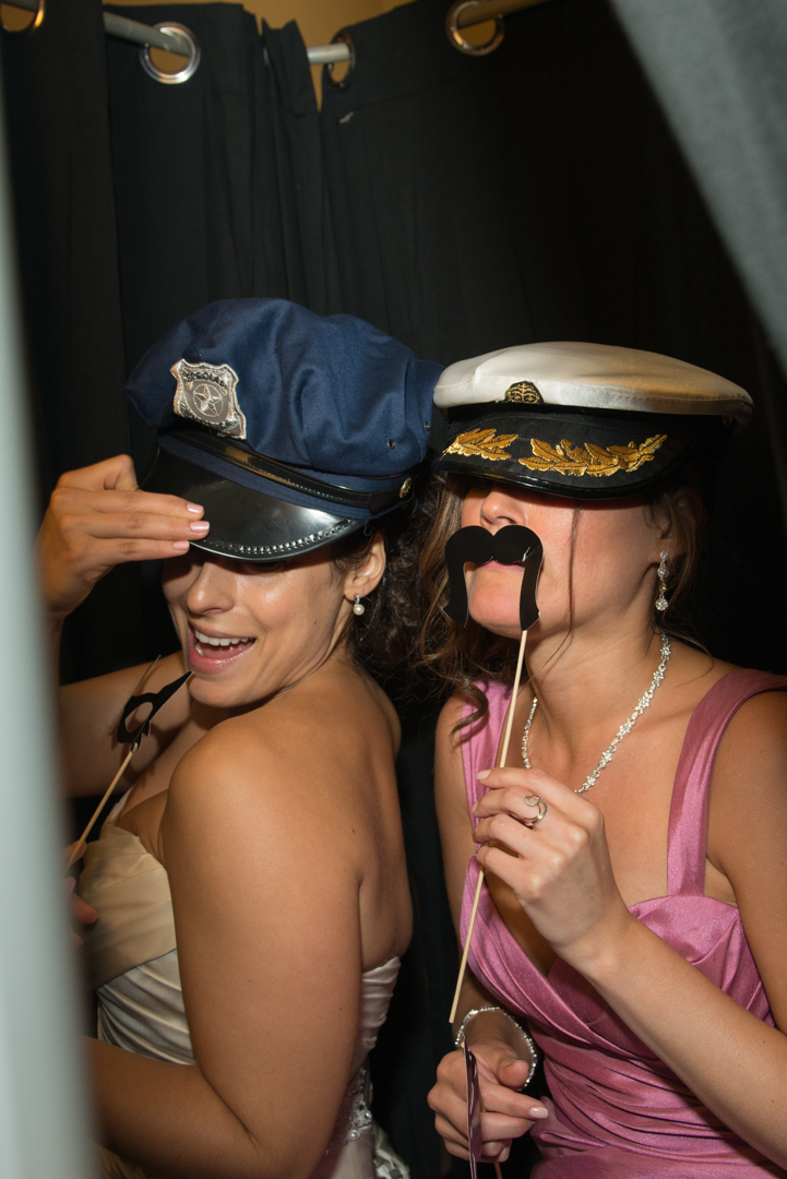 Wedding guests in captain hats with props at the Candlewood Inn in Brookfield CT photo booth