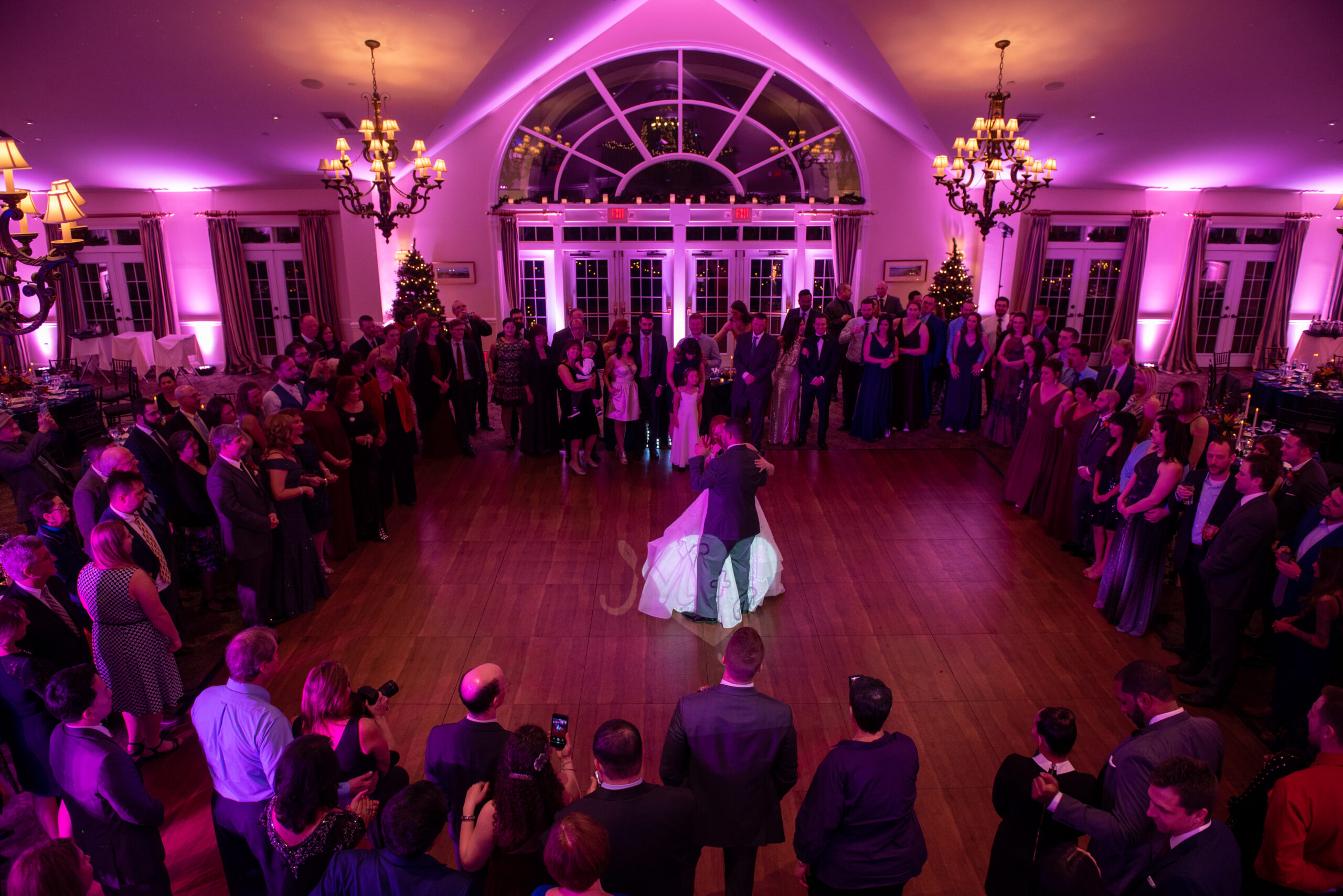 Purple uplighting and packed dance floor at the Riverhouse at Goodspeed Station in East Haddam CT