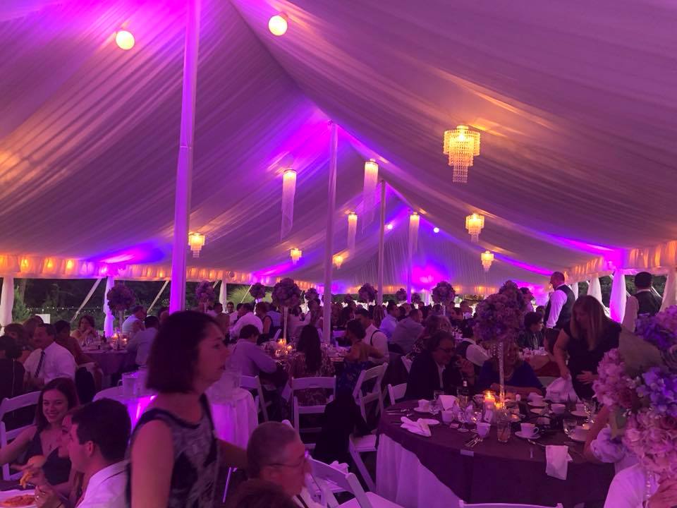 Wireless uplighting inside a tented Connecticut wedding reception